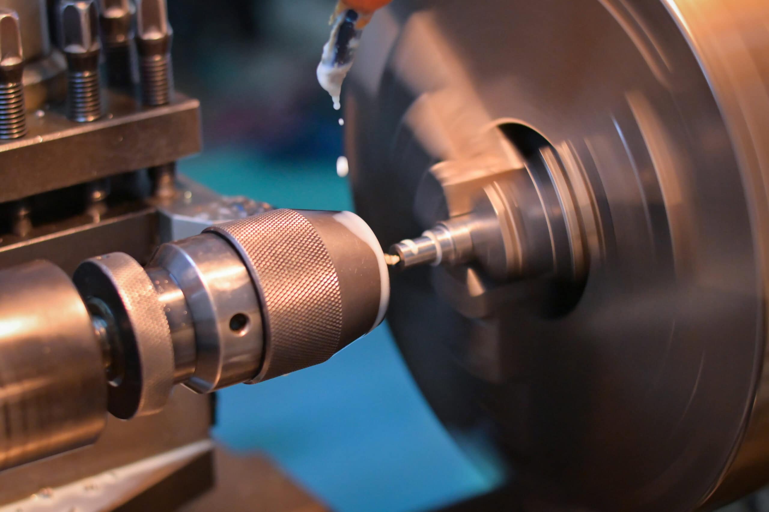 Turning machine is drilling workpiece on head chuck. High speed hard carbon cnc machining Turning machine is drilling workpiece on head chuck. High speed hard carbon cnc machining